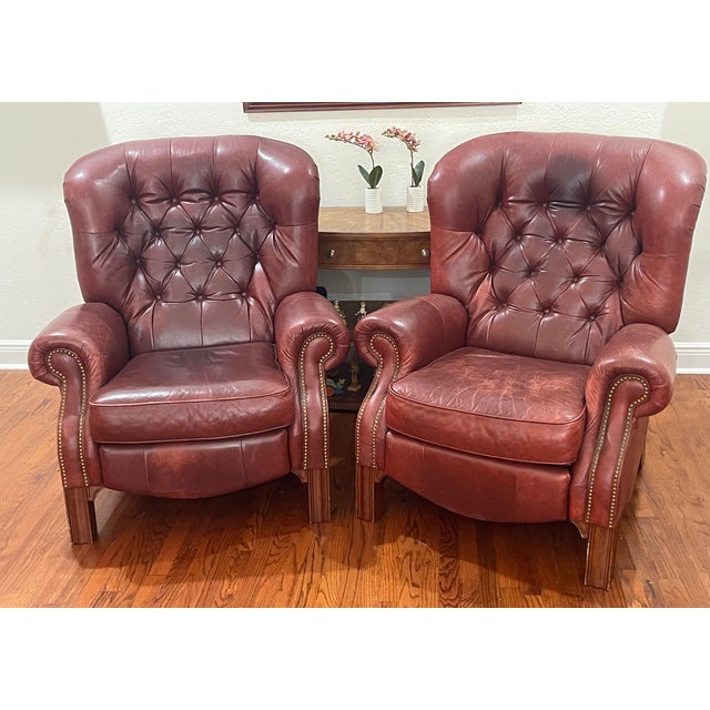 Great pair of 20 th c vintage tufted oxblood leather with decorative nails writers recliner armchairs. Heavy, solid and...