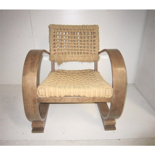 A set of two French midcentury tribal lounge chairs designed by Adrien Audoux & Frida Minet for manufacturer Vibo Vesoul....