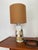 Elegant mid-century modern table lamp designed by Ellen Malmer for Royal Copenhagen, Denmark. This piece features the...