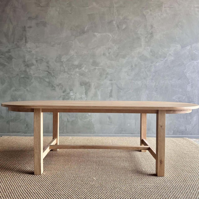 Introducing our exquisite Amber oval dining table, crafted from beautiful white oak for a touch of elegance. Its solid...