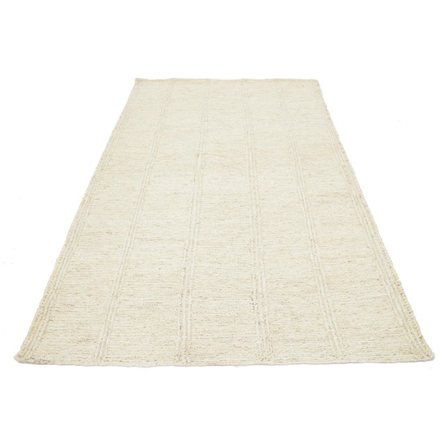 Modern Soumak Natural Jute Rug. This rug measures 5'1'' x 8'4''. Custom sizes are made-to-order. Material: 100% Jute....
