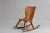 Swedish hand-made pine rocking chair in the style of Axel Einar Hjorts furniture. The rocking chair is in good vintage...