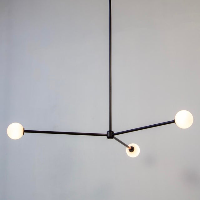 Three orbs, infinite mood. The Globe 3 floats in sync - bright, balanced, and a little bit fun.