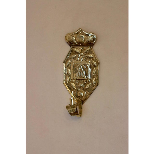 Beautiful Swedish brass wall sconces, featuring hammered floral designs. Both pieces are in very good vintage condition,...