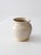 This vintage handmade studio pottery vase features a rounded hand-thrown form with a soft creamy glaze, exposed clay foot,...