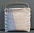 A charming signed handmade studio pottery wall pocket crafted in glazed stoneware, with a soft blue and cream speckled...