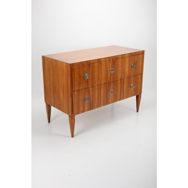 Elegant cherry veneered chest of drawers, distinguished by its clean lines and spacious drawers, with box locks, 2 keys,...