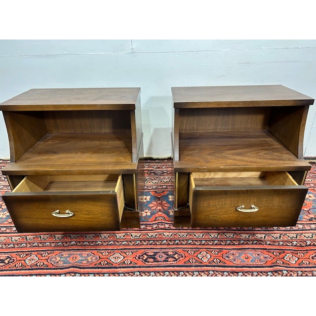 The Pair of Vintage Sheffield Furniture Mid-Century Nightstands offers a perfect blend of functionality and sleek design,...