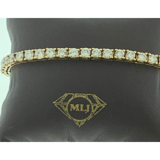 42 Round Diamond 25 Pointer Each Line Tennis Bracelet 14 K Yellow Gold 10 Ct Meet the ultimate bold tennis bracelet. The...