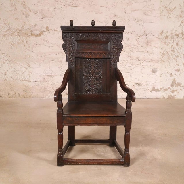 This 17th Century English Oak Gothic Carved Chair is a rare and historically significant antique, showcasing the bold...