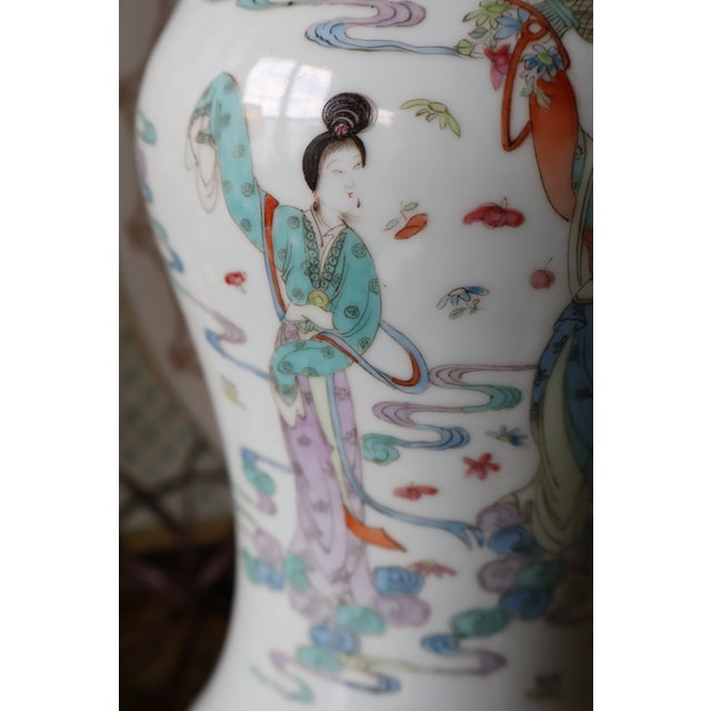 A graceful vintage Chinese porcelain table lamp combining a pale celadon-glazed ground, delicate famille rose–style...