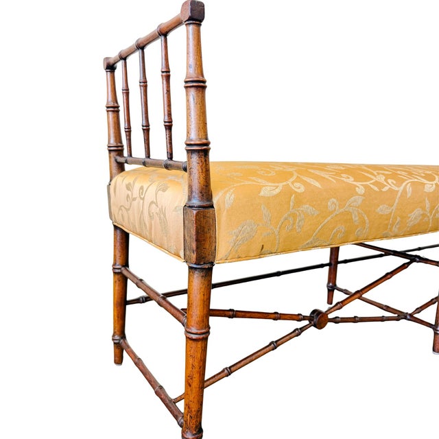 A fantastic 1960s French Regency style faux bamboo bench featuring elegant turned wood faux-bamboo joinery, delicate...
