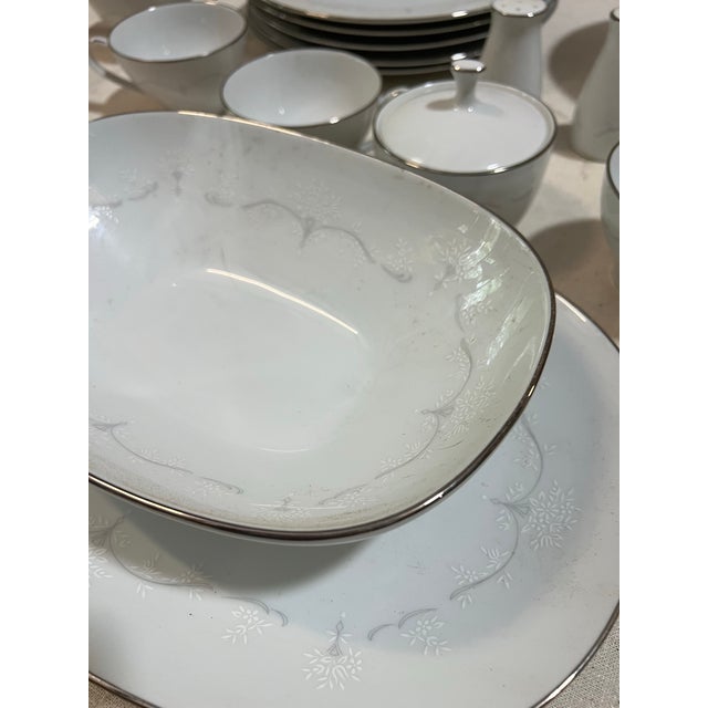 Up for consideration is a beautiful vintage collection of Noritake silver rimmed plates and serving pieces. This set is...