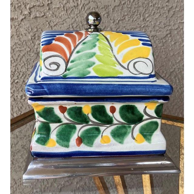 Excellent Pre-Owned Condition. With its stylish hump chest profile, this nicely weighted Talavera box is perfectly suited...
