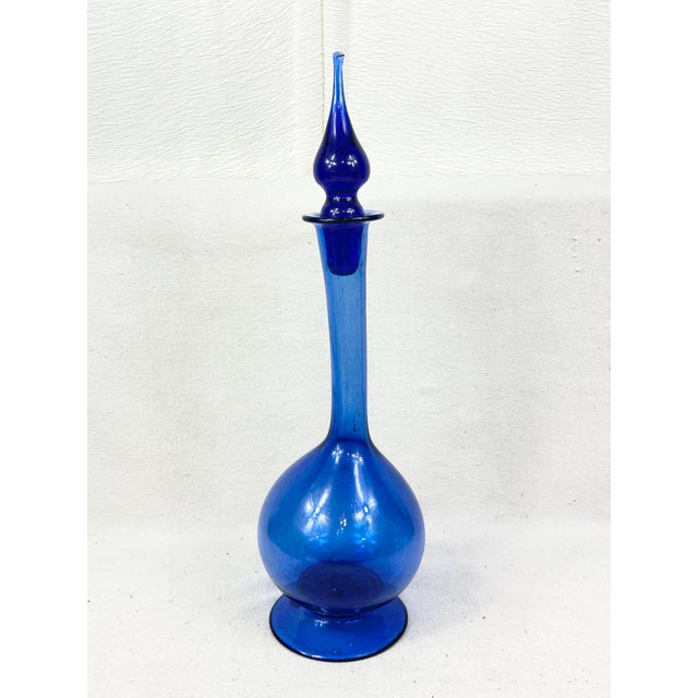 Elevate your mid-century barware collection with this striking vintage decanter, masterfully crafted by the renowned...