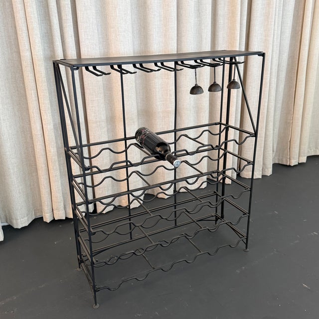 This versatile late 20th century dry wine bar console features a streamlined black wrought iron frame equipped with five...