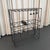 This versatile late 20th century dry wine bar console features a streamlined black wrought iron frame equipped with five...