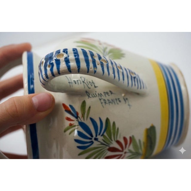 A charming, authentic pair of hand-painted French faience pottery pieces from the historic HenRiot Quimper pottery in...
