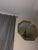 Vintage octagonal wall mirror featuring a solid brass-tone frame and decorative etched glass. The faceted, geometric...