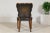 This richly detailed desk chair features a sculptural silhouette and handsome materials, blending comfort with classic...