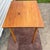 This charming late 19th to early 20th-century antique American folding work table features a rich honey brown finish that...