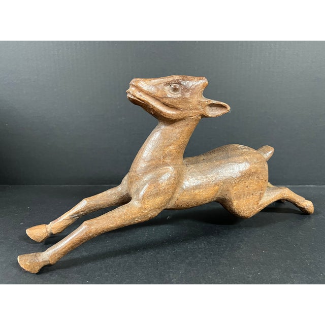 ITEM NAME: Late 20th Century Carved Wood Deer Sculpture ORIGIN: Philippines AGES: Late 20th Century MATERIALS: Wood...