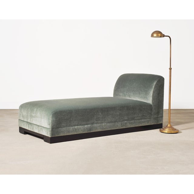 A classic pair of matching mid-century modern style height adjustable pharmacy floor lamps featuring a patinated brass...