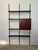 Iron and wood wall bookcase by Osvaldo Borsani E22 production Tecno 1960s Modular wall-mounted bookcase, wood and metal,...