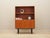 The bookcase was made in the 1960s in Denmark. The structure is covered with teak veneer. The legs are made of solid wood...