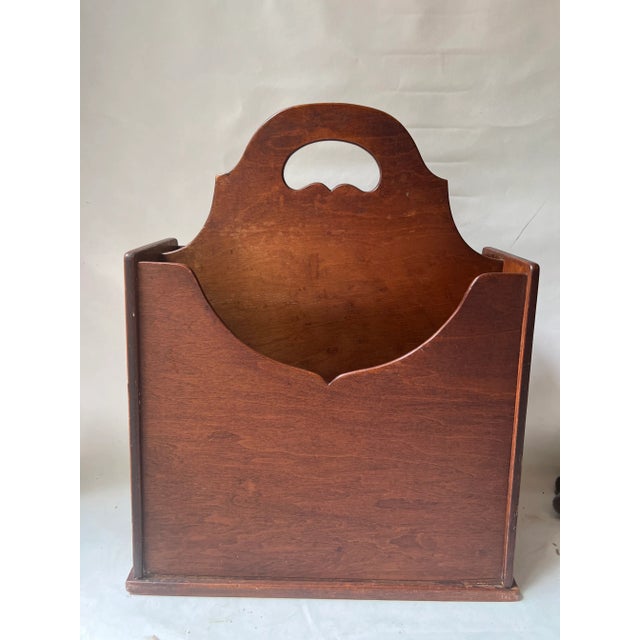 A Conant-Ball Co. wooden magazine rack. Vintage rack with two compartments and center handle. Approximately 18” tall 14”...