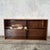 A beautifully understated mid-century Danish-style teak bookcase featuring two sliding glass doors, a warm teak finish and...
