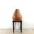 A treen carving of a pear in pear wood on a custom stand. The pear measures 20" h x 18" w x 17.25" d, and the stand...