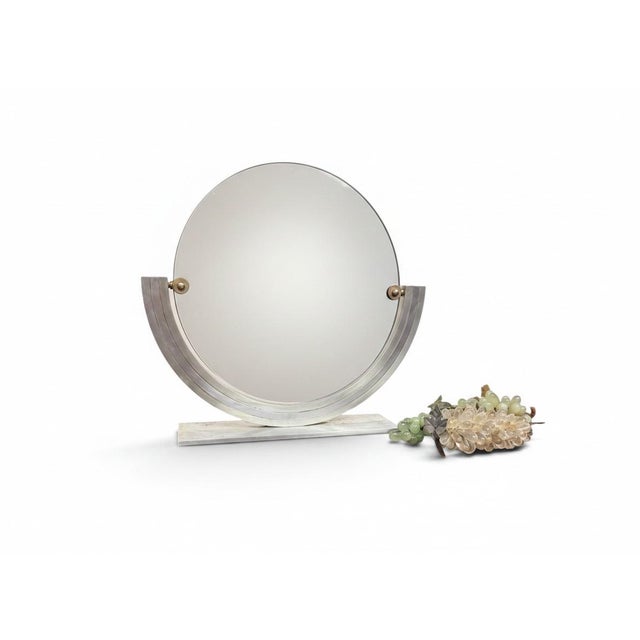 Specifications Its design is defined by a striking circular glass pane suspended within a stepped, semi-circular metal...