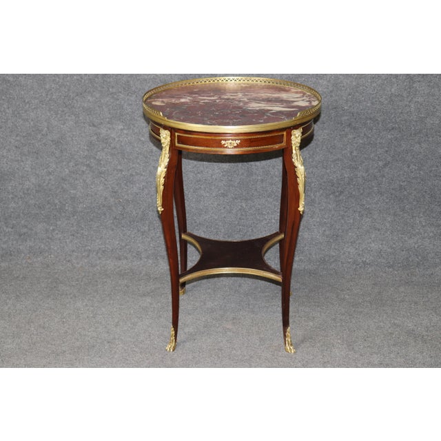 This exquisite **French Louis XV style occasional table with drawer** by the renowned Parisian ébéniste **Millet**...