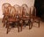 Exquisite set of six 19th-century English Windsor chairs in oak. A beautiful set with a lovely patina. They feature...