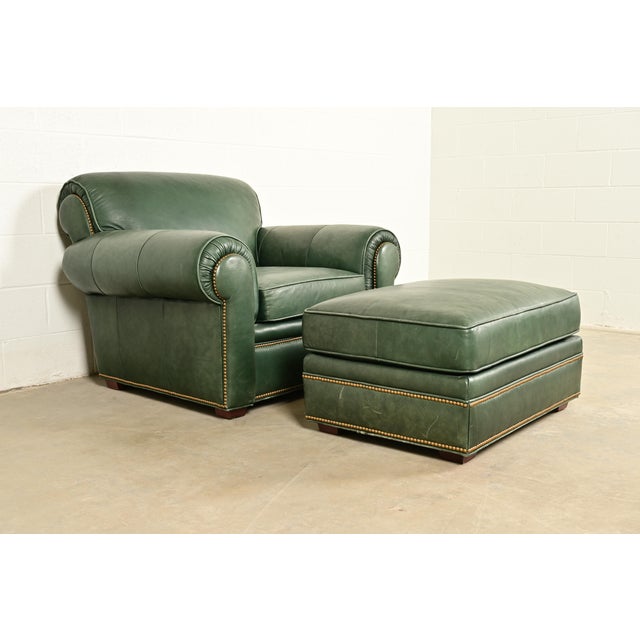 A gorgeous Art Deco style studded leather lounge chair with ottoman By Century Furniture USA, Circa 1980s Measures: Chair...