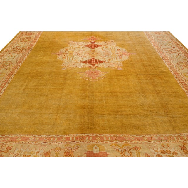 A masterpiece of Vintage Turkish craftsmanship, this hand-knotted wool rug flaunts an eye-catching goldenrod field...