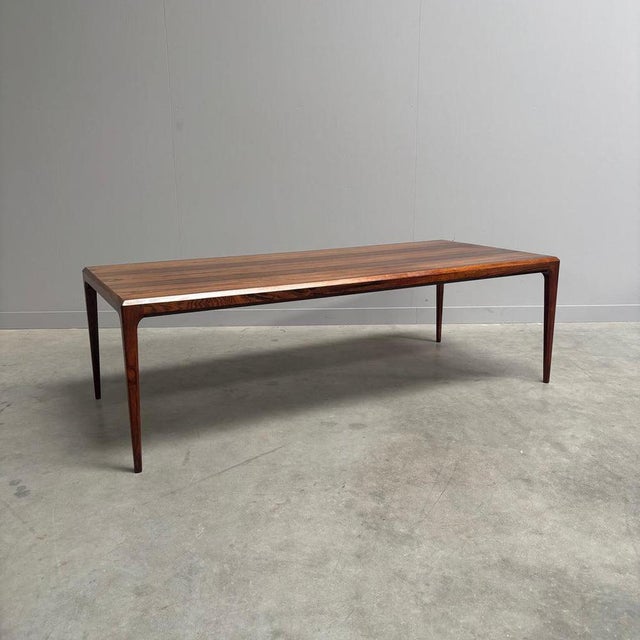 Remarks: Large vintage coffee table by Johannes Andersen for Silkeborg, Danish design 1960s. Wooden table top veneer with...