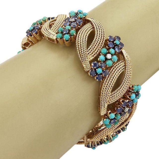 This Diamond Sapphire & Turquoise 14k Rose Gold Bracelet is a stunning piece of vintage and antique jewelry. The bracelet...