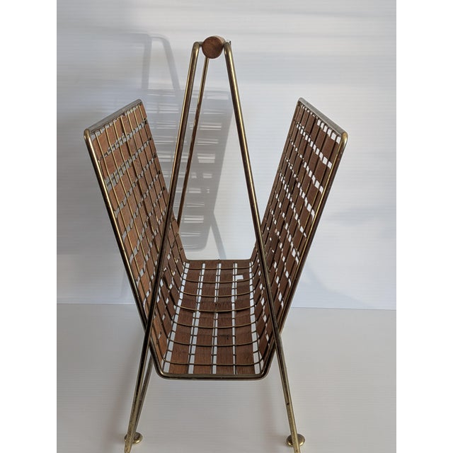 An iconic Tony Paul 1950's magazine rack designed as part of his Interlace line for Woodlin-Hall. Hold magazines or Vinyls...