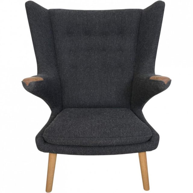 Hans Wegner Papa Bear chair with stool, upholstered in grey Hallingdal fabric, and with legs and armrests of oak. The...