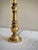 A handsome matched pair of vintage brass table lamps, dating approximately to the 1960s–1970s, with sculptural baluster-...