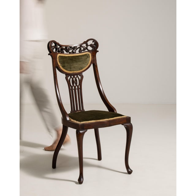 A classic side chair featuring a mahogany frame and upholstered seat, combining elegance with everyday functionality. The...
