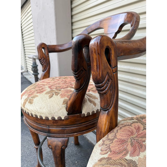 Elegant pair of swivel bar stools Attributed to showcasing the brand’s signature craftsmanship and classic Regency-...