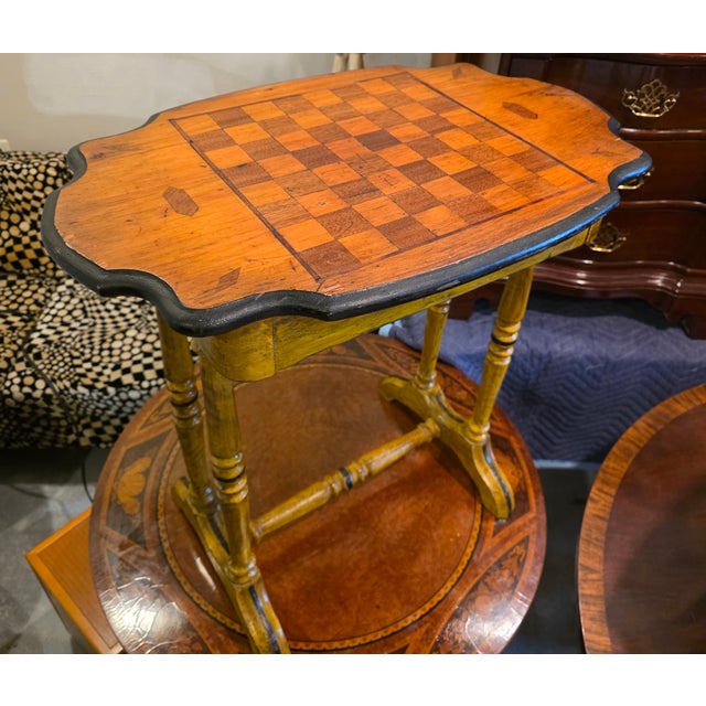 Featured is an Early 19th Century English Country Style Single-Drawer Chess or Games Table with a beautifully inlaid chess...