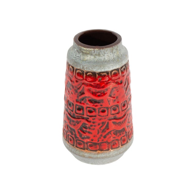 A West German ceramic vase produced by Carstens Tönnieshof. This mid-century vase features a "prehistoric" design with...