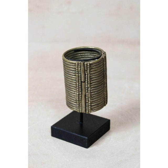 ​a monument to abyssinian artistry ​while many such cuffs were cast in brass, this rare silver-toned variant offers a...