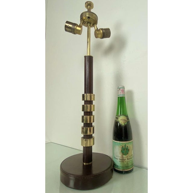 Beautiful Machine Age Heavy (5 kgs!) table lamp, made of stitched brown leather and thick bronze rings. Very impressive as...