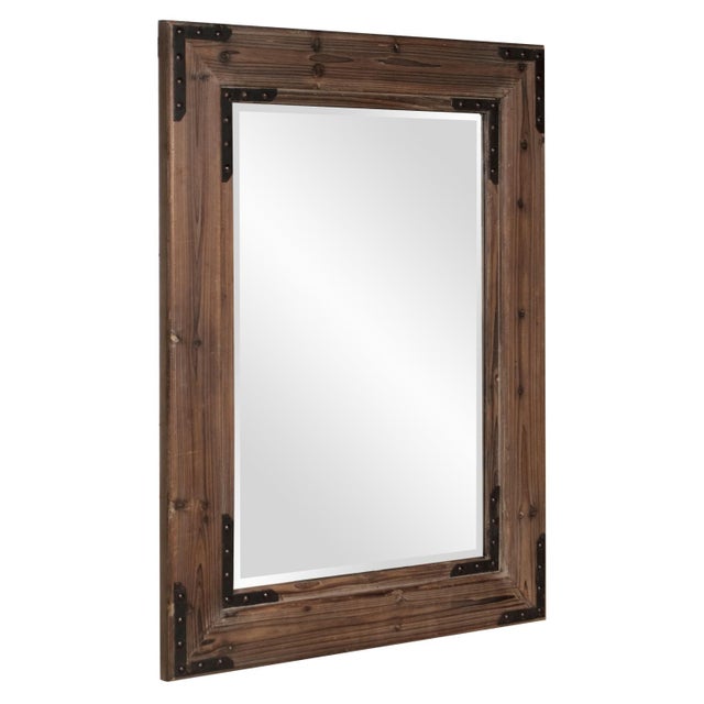 This Caldwell Mirror features a rectangular frame fashioned from natural wood mitered at the corners. A brown stain...