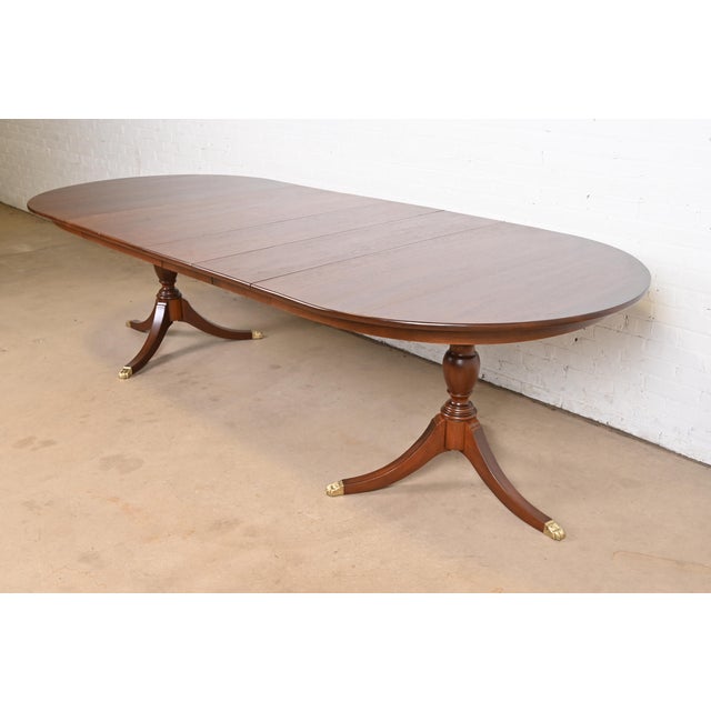 An exceptional Georgian or Regency style double pedestal extension dining table By Henkel Harris USA, 1970 Gorgeous solid...